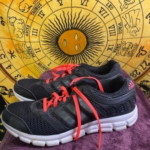 Pink and black adidas running shoes